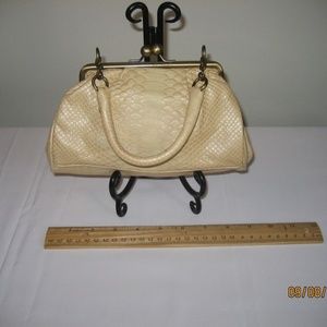 Little Kenneth Cole Recations pale yellow purse.
